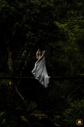   In São Paulo, the bride is elegantly portrayed in a beautiful and timeless portrait in the woods.